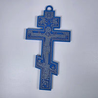 Blue 3D-printed Orthodox crucifix with gray iconographic relief and hanging loop